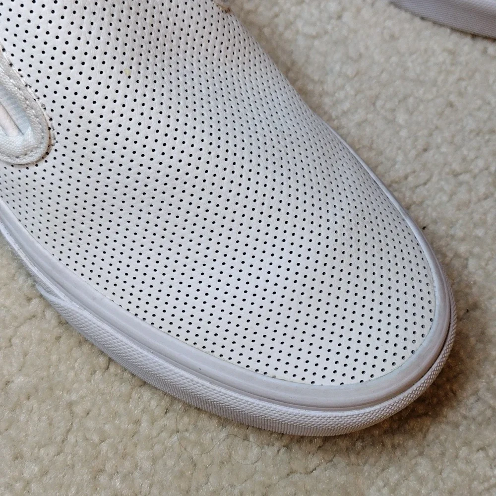 Vans men's white perforated leather slip on loafers. Size 5.5